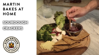 Tray with crackers, dip, veggies, and cheese